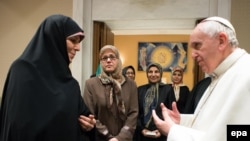 Pope Francis receives Iranian Vice President Shahindokht Molaverdi (L), in Vatican City, February 12, 2015