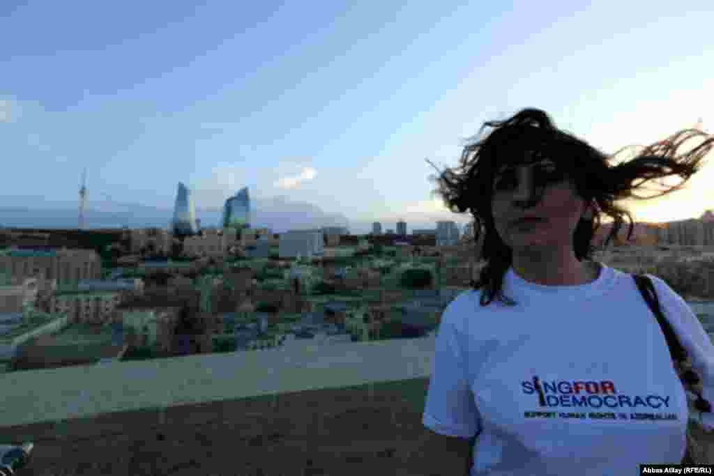 This woman sports a pro-democracy T-shirt. Many activists used the media attention surrounding Eurovision to raise concerns about Azerbaijan&#39;s human rights record.