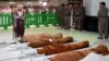 A Saudi cleric and mourners pray in the holy mosque in Mecca on January 6 during the funeral of three Saudi guards who were killed in an attack and suicide bombing and another two other bodies who died in other circumstances.