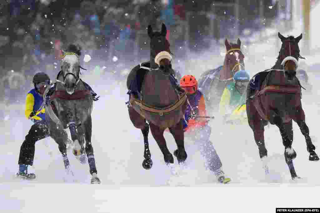 Horse racing during the Grand Prix Credit Suisse on the frozen lake in St. Moritz, Switzerland. (epa-EFE/Peter Klaunzer)