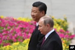 Си Цзиньпин и Владимир Путина в 2018 году