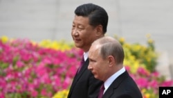 Russian President Vladimir Putin (foreground) and Chinese President Xi Jinping in Beijing in 2018.