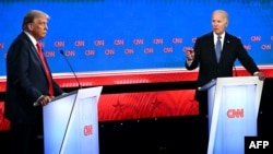 U.S. President Joe Biden (right) and former U.S. President and Republican presidential candidate Donald Trump participate in the first presidential debate of the 2024 elections at CNN's studios in Atlanta, Georgia, on June 27, 2024. 
