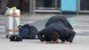 FILE: An Afghan, whose asylum application was been rejected, kisses the ground after he arrived from Germany in Kabul airport in December, 2016.