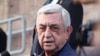 Armenia - Former President Serzh Sarkisian talks to journalists outside a court in Yerevan, October 22, 2025.