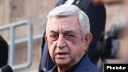 Armenia - Former President Serzh Sarkisian talks to journalists outside a court in Yerevan, October 22, 2025.