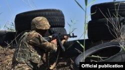 An Armenian solider mans an outpost on his country's border with Azerbaijan. (file photo)