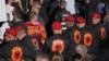 Disa burra të veshur me uniformë të UÇK-së rreshtohen në protestën e 1 tetorit në Prishtinë kundër aktgjykimit të Hagës për dënimin e ish-udhëheqësve të UÇK-së me burgim për krime lufte.<br><br>Shqiptarët e Kosovës po protestojnë kundër aktgjykimit qysh nga dita e shqiptimit të tij në Hagë më 16 shtator.
