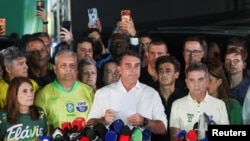 ბრაზილიის საპრეზიდენტო არჩევნების მეორე ტურის ოფიციალური შედეგების გამოქვეყნების შემდეგ ფლავიუ ბოლსონარუმ(ცენტრში) განაცხადა, რომ ამ შედეგების აღიარება შეუძლებელია.