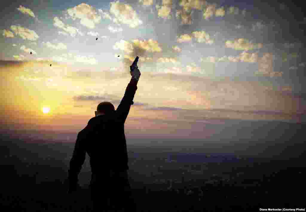 Kazbek Mutsaev, 29, fires celebratory gunshots at sunset on the outskirts of Grozny, part of an age-old wedding tradition.