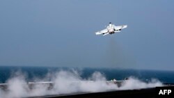 An F-18 Super Hornet takes off from the flight deck of the USS Dwight D. Eisenhower in October 2016 in the Persian Gulf. The Pentagon confirmed that a Syrian fighter bomber was downed by a U.S. F-18 Super Hornet on June 18.