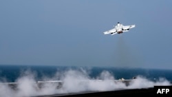 A F/A-18E Super Hornet takes off from the flight deck of the aircraft carrier USS Dwight D. Eisenhower on October 20, 2016 in the Gulf, October 21, 2016