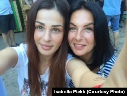 Isabella Pekh (left) with her mother, Olena. (file photo)