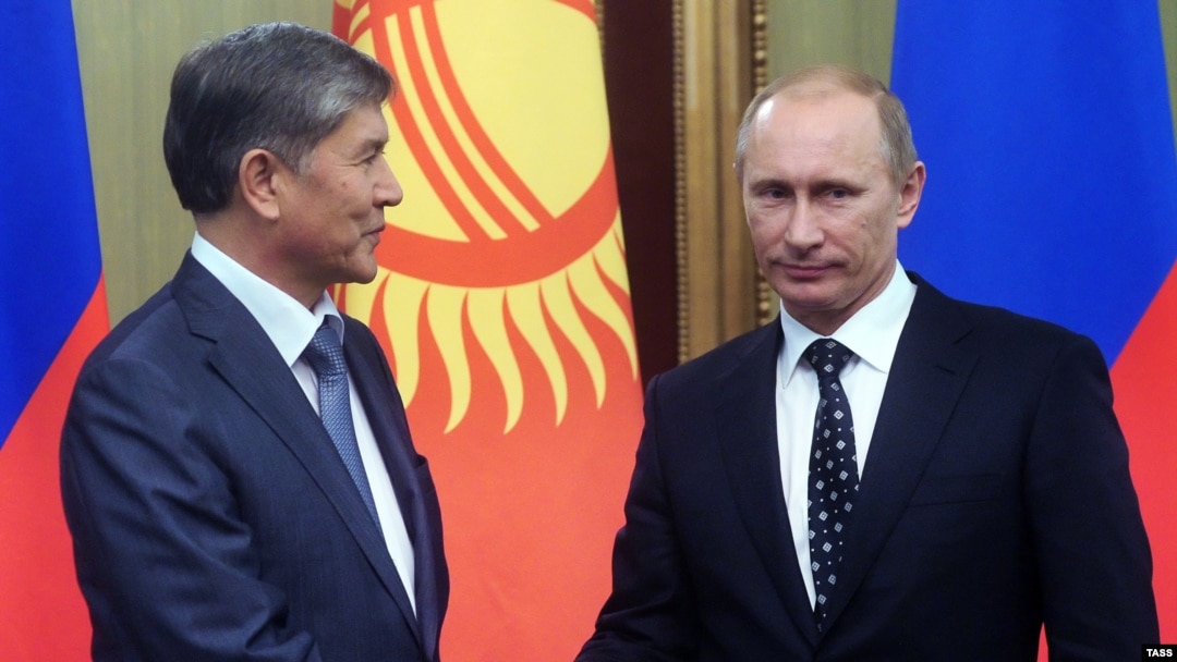 Russian Prime Minister and President-elect Vladimir Putin (right) with Kyrgyz President Almazbek Atambaev (file photo)