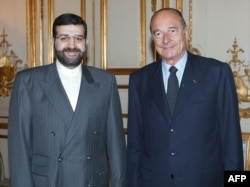 Iran's Ambassador to France Seyed Mohammad Sadegh Kharrazi (L) poses with President Jacques Chirac, at the Elysee Palace in Paris, November 12, 2002