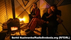 A mobile bathhouse and warm inflatable tent provided for people during the blackout in Kyiv.