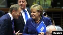 Polish Prime Minister Donald Tusk, British Prime Minister David Cameron, German Chancellor Angela Merkel, and EC President Herman Van Rompuy (left to right) will meet at the European Union summit in Brussels.