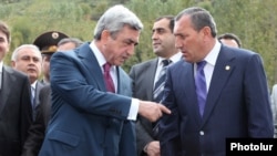 Armenia -- President Serzh Sarkisian (L) talks to Syunik Governor Suren Khachatrian.