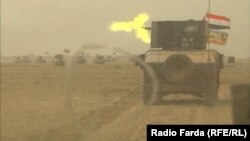 На кадре из видео — колонна иракских правительственных сил на подступе к городу Мосул, удерживаемому экстремистами. 