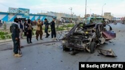 The scene of an explosion that targeted the vehicle of a local police commander in Kandahar on April 19. Taliban assaults on foreign troops have largely ceased since a February 2020 peace deal, but attacks have continued against Afghan security forces and government personnel.