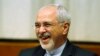 Switzerland -- Iranian Foreign Minister Mohammad Javad Zarif smiles at a plenary meeting at the start of three days of closed-door nuclear talks at the United Nations European headquarters in Geneva November 20, 2013.