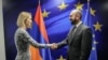 Armenian Foreign Minister Ararat Mirzoyan shakes hands with EU foreign policy chief Kaja Kallas in Brussels on April 14. 