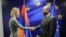 Armenian Foreign Minister Ararat Mirzoyan shakes hands with EU foreign policy chief Kaja Kallas in Brussels on April 14. 