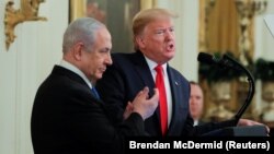 U.S. President Donald Trump (right) and Israeli Prime Minister Benjamin Netanyahu hold a joint news conference to discuss a new Middle East peace-plan proposal in the White House in Washington on January 28. 