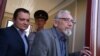 Boris Khodorkovsky (right), the father of former Yukos CEO Mikhail Khodorkovsky, leaves the offices of the Russian Investigative Committee, where was summoned for questioning in August in connection to Nefteyugansk Mayor Vladimir Petukhov's murder.