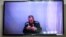 Jailed Kremlin critic Aleksei Navalny appears via a video link from prison during a court hearing on May 26.