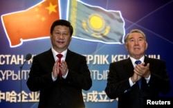 Xi and former Kazakh President Nursultan Nazarbaev attend a ceremony during Xi's September 2013 visit to the Central Asian country where he made a speech regarded as a precursor to the BRI.