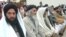 Delegation members of a pro-Taliban leader Sufi Mohammad, attend a meeting with Pakistani government officials, political and religious leaders in Peshawar