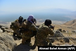 Anti-Taliban fighters patrol in the Anaba district.