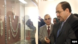 Nuri al-Maliki inspects antiquities in the reopened National Museum in Baghdad.