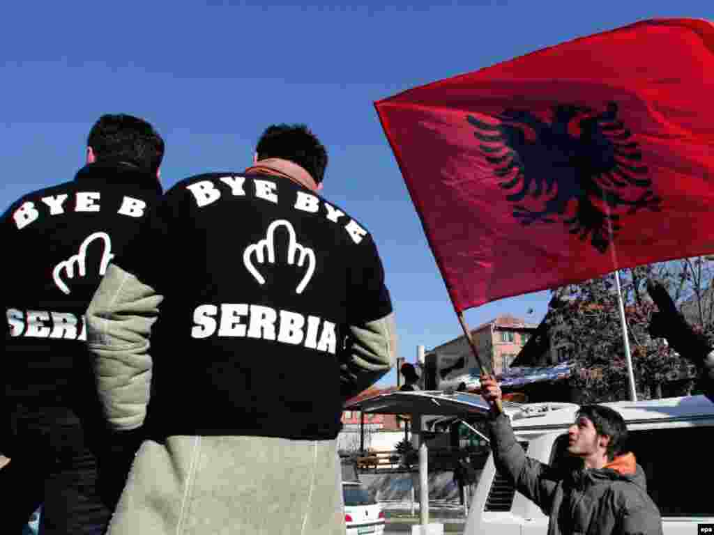 In the capital, a Kosovar Albanian man wears a T-shirt reading "Bye Bye Serbia." The authorities are offering a 72-hour cultural program and many bars are laying on free drinks. 