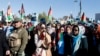 Supporters of presidential contender Abdullah Abdullah rally in Kabul on November 29.