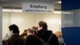 Germany - Job seekers stand in front of the reception at a unemployment centre "Agentur fuer Arbeit" on April 11, 2012, at the district Kreuzberg in Berlin, Germany. 