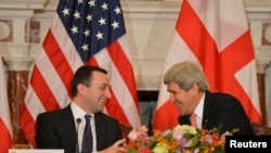 U.S. Secretary of State John Kerry (right) speaks with Georgian Prime Minister Irakly Garibashvili in Washington on February 26. 