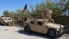 Afghan security personnel patrol in Lashkar Gah, capital of Helmand Province on October 21.