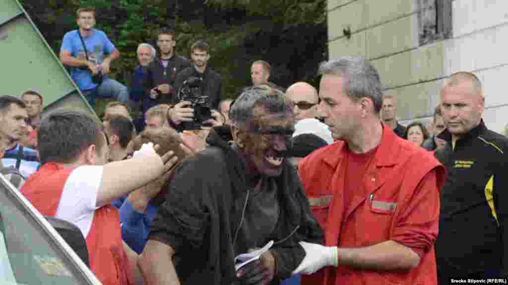 An injured miner is evacuated from a collapsed mine in Zenica, Bosnia-Herzegovina, on September 5. Five miners died in the accident, which was triggered by an earthquake. (RFE/RL)