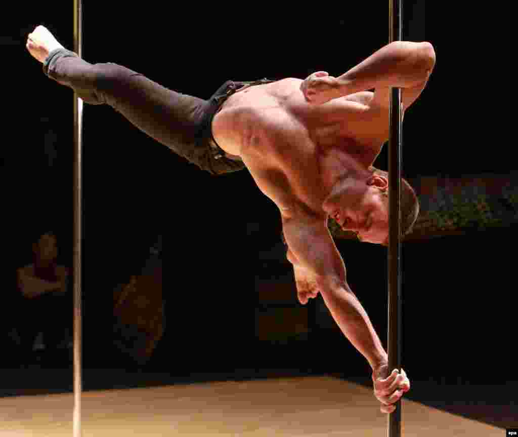 Ukrainian pole dancer Dmitry Fedotov performs during the Kyrgyzstan Pole Dancing Championships in Bishkek. (epa/Igor Kovalenko)