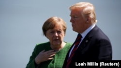 German Chancellor Angela Merkel talks with U.S. President Donald Trump at the G7 summit last month.