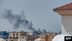 A smoke plume rises over Abu Dhabi from the site of an Iranian missile strike on February 28.