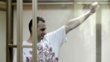 RUSSIA – Ukrainian film director Oleh Sentsov gestures inside a defendants' cage as he attends a court hearing in Rostov-on-Don, Russia, August 25, 2015