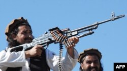 Taliban commander Hakimullah Mehsud (left) poses for media in the Mamouzai area of Pakistan in 2008