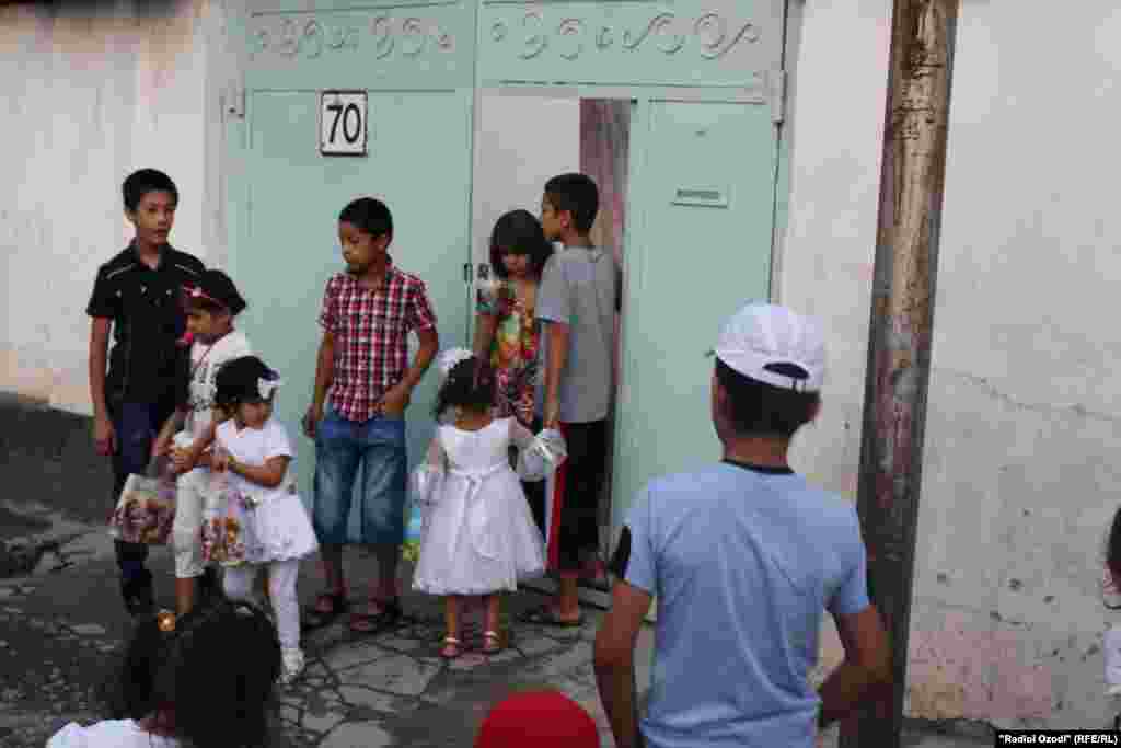 Children in Dushanbe, Tajikistan, receive holiday gifts, candy, and pocket money.