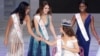 China - Miss Thailand Nicolene Limsnukan (L) next to Belarus's Maria Vasilevic