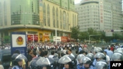 A U.S.-based Uyghur group issued this photo soon after the Xinxiang violence erupted, showing clashes in Urumqi.