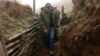 Armenian Prime Minister Nikol Pashinian walks through trenches in Nagorno-Karabakh on the "line of contact" with Azerbaijan during a visit in September.