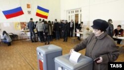 A woman votes at a polling station in Rostov na Donu.